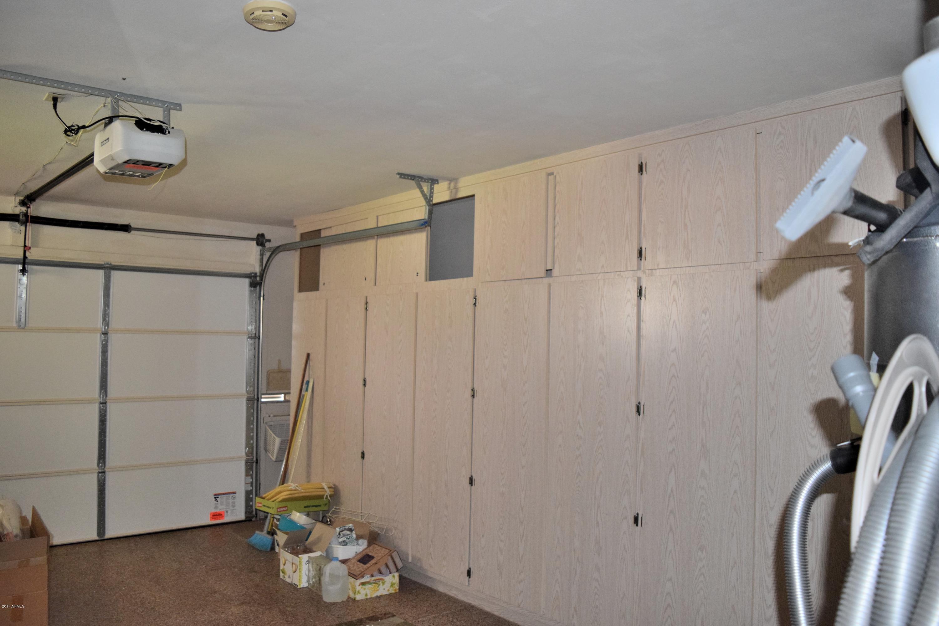 10721 West Hatcher Road Sun City, AZ 85351 - Photo 25 of 52 Garage cabinets