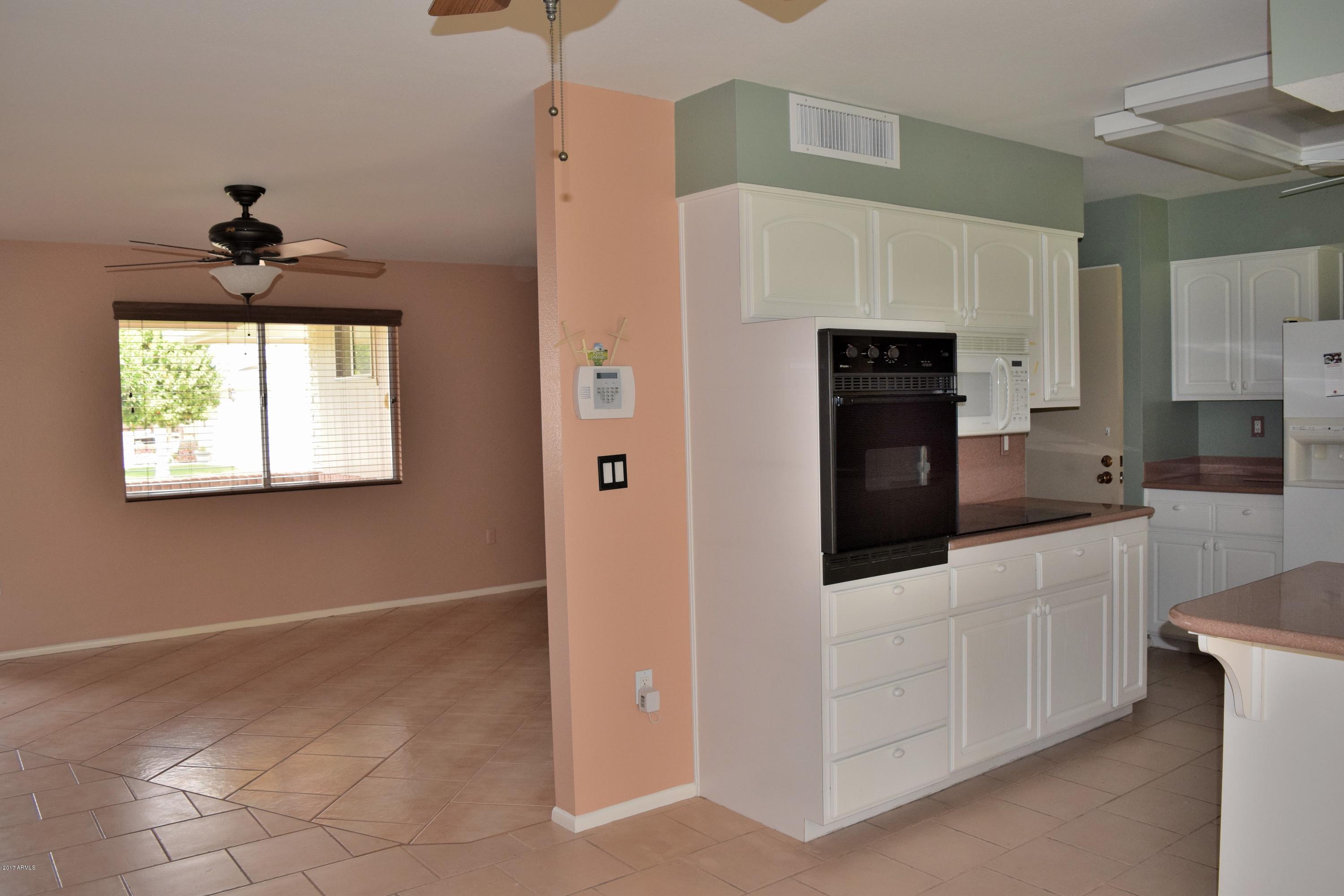 10721 West Hatcher Road Sun City, AZ 85351 - Photo 7 of 52 Kitchen to living room