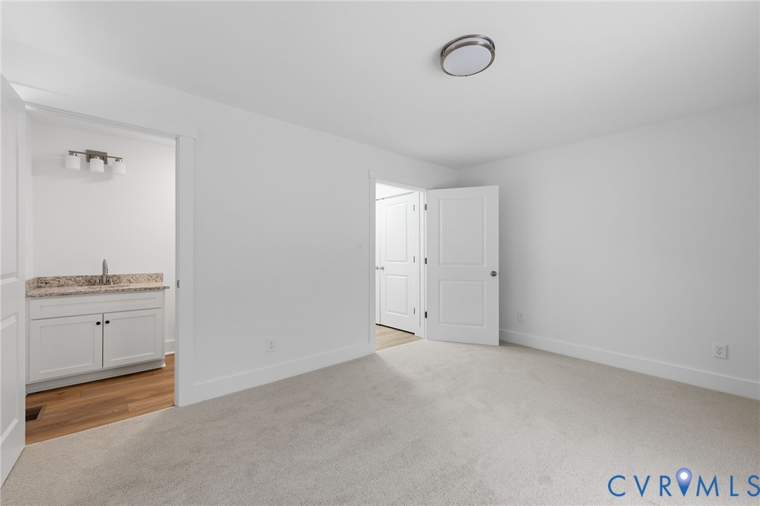 303 Dry Bridge Road Farmville, VA 23901 - Photo 11 of 23 The spacious primary bedroom features new carpet,