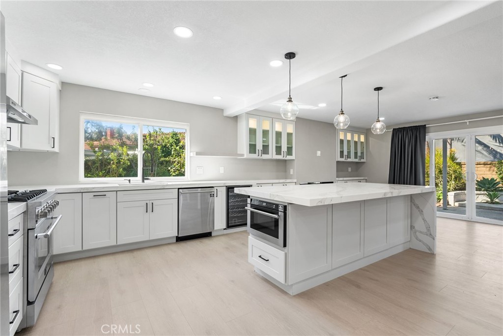 24746 Scott Lane Lake Forest, CA 92630 - Photo 14 of 31 a kitchen with a stove and a sink