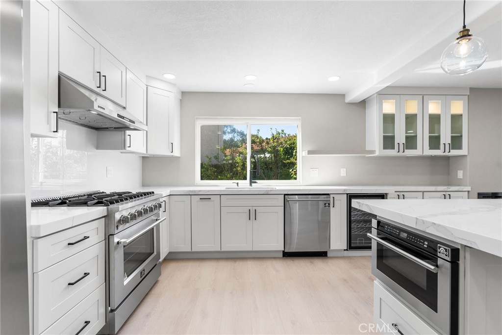 24746 Scott Lane Lake Forest, CA 92630 - Photo 15 of 31 a kitchen with a stove oven and sink