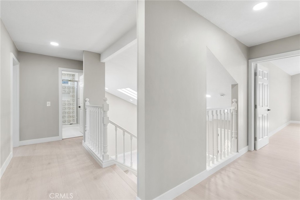 24746 Scott Lane Lake Forest, CA 92630 - Photo 19 of 31 a view of a hallway with wooden floor