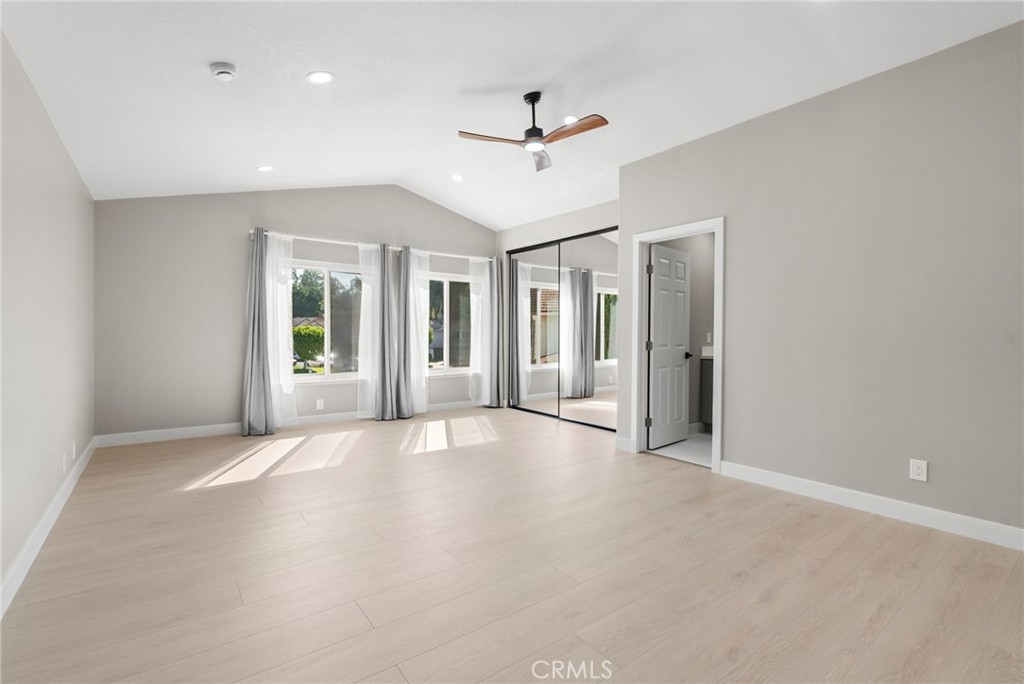24746 Scott Lane Lake Forest, CA 92630 - Photo 20 of 31 an empty room with ceiling fan and windows