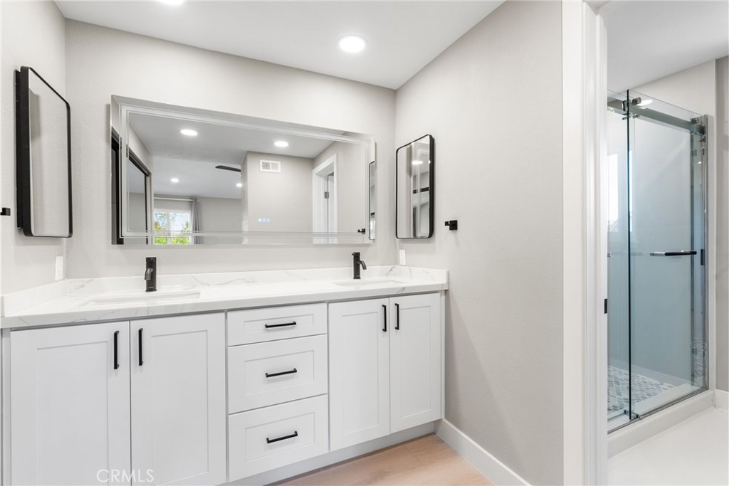 24746 Scott Lane Lake Forest, CA 92630 - Photo 24 of 31 a bathroom with a double vanity sink and mirror