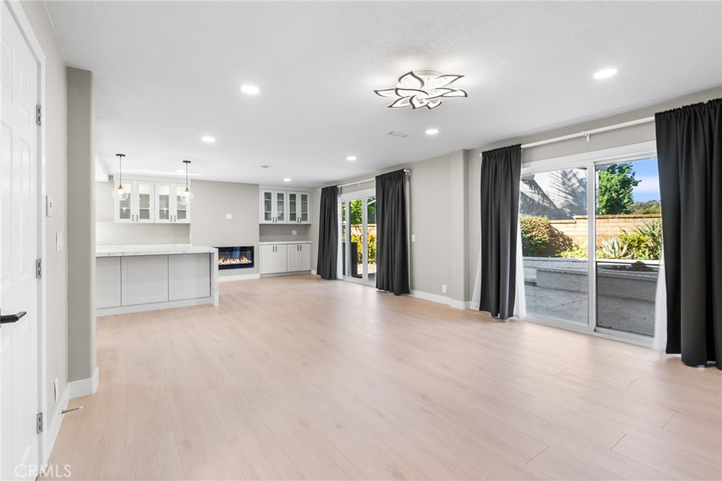 24746 Scott Lane Lake Forest, CA 92630 - Photo 7 of 31 a view of a kitchen with furniture and a floor to ceiling window
