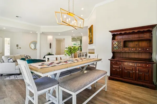 a large kitchen with a table and chairs