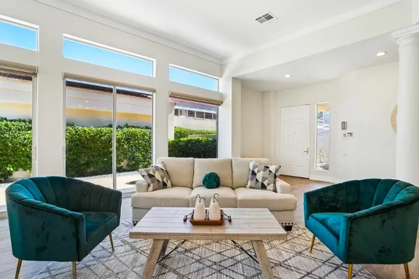 a living room with furniture and a large window