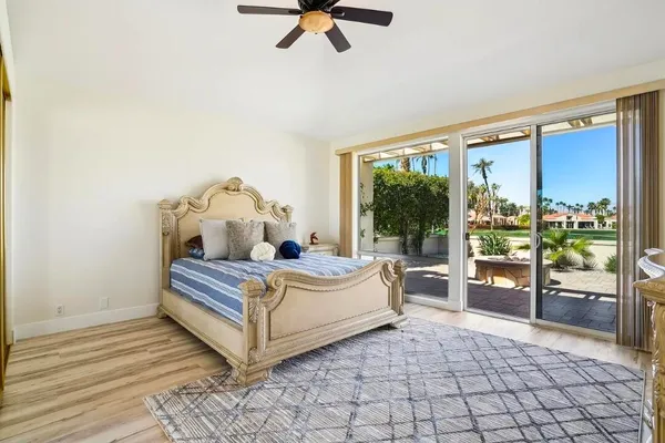 a living room with a large bed and a large window