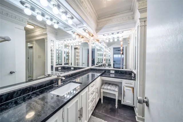 a bathroom with a sink and a large mirror