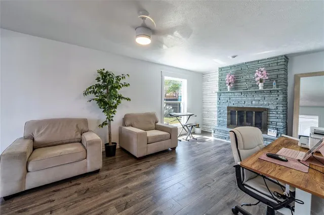 a living room with furniture and a fireplace
