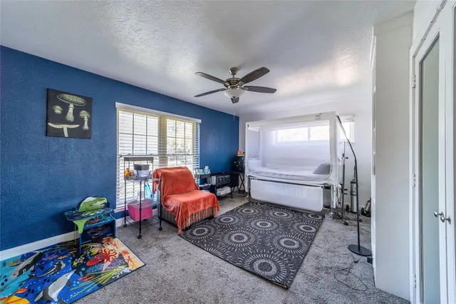 a bed room with furniture and a window