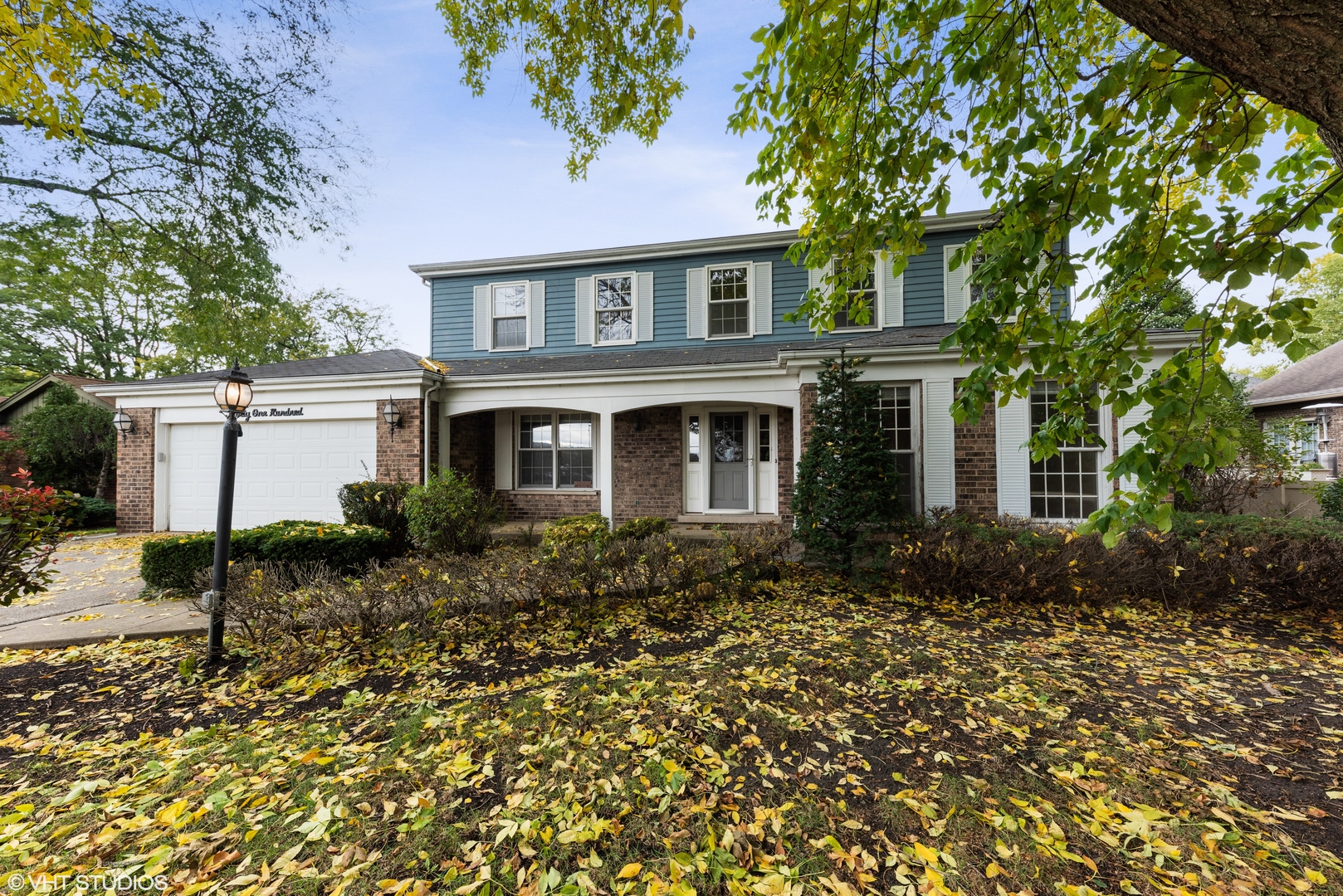 3100 Techny Road Northbrook, IL 60062 - Photo 1 of 28 a front view of a house with garden