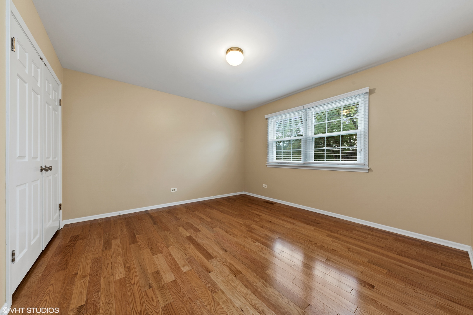 3100 Techny Road Northbrook, IL 60062 - Photo 18 of 28 an empty room with wooden floor and windows