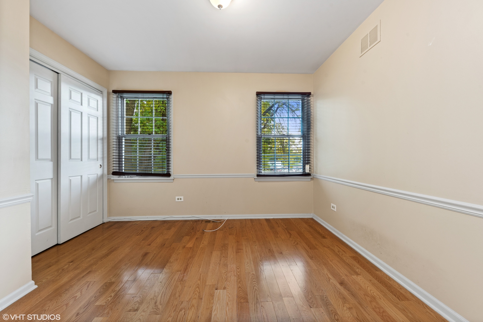 3100 Techny Road Northbrook, IL 60062 - Photo 20 of 28 an empty room with wooden floor and windows