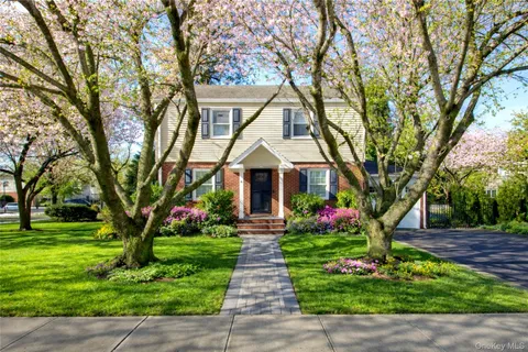 a front view of a house with garden