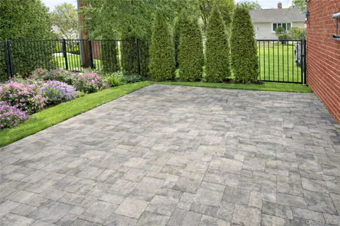 a view of a garden with a house