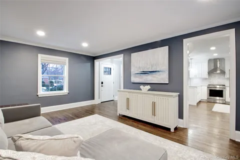 a bedroom with a bed and a large mirror