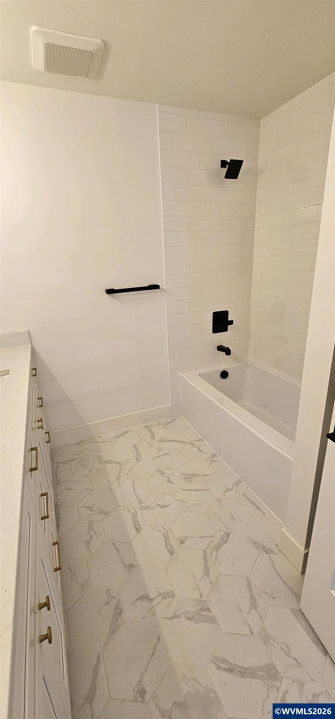 Model B Salishan Street Southeast Salem, OR 97302 - Photo 19 of 30 a bathroom with a bathtub and shower