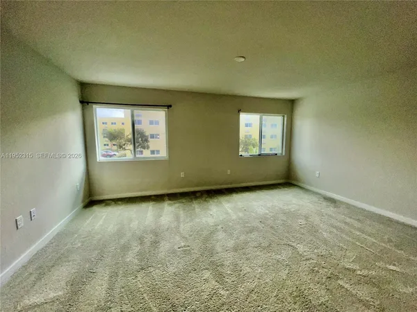 an empty room with windows