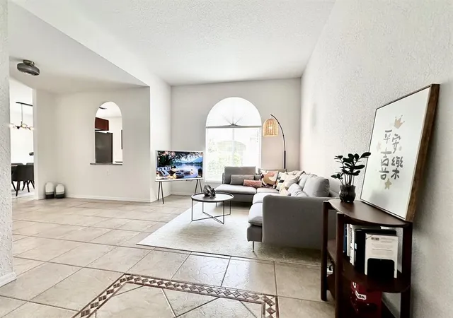 a living room with furniture and a large window