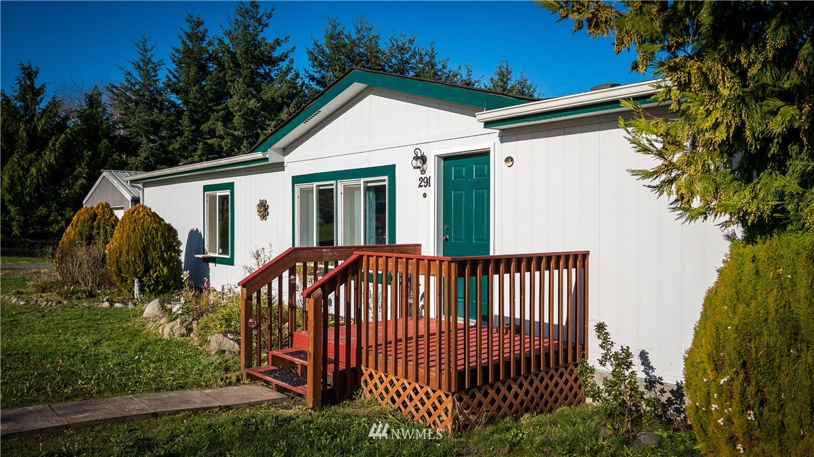 291 Spencer Road Sequim, WA 98382 - Photo 2 of 24 a view of a house with backyard and sitting area