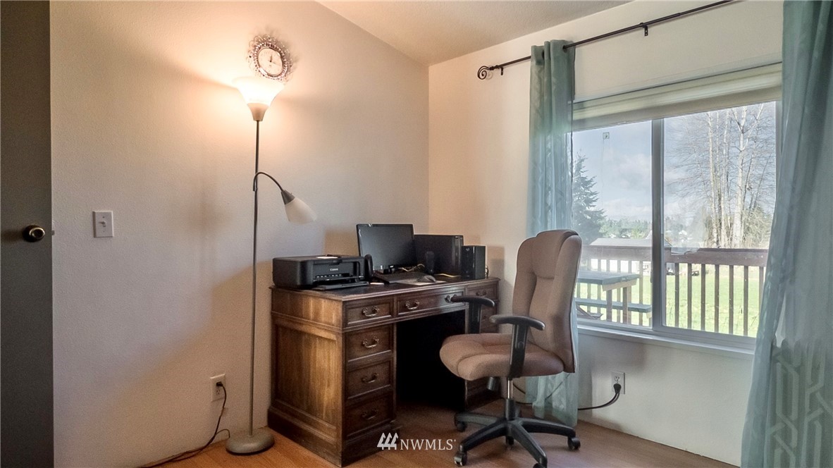 291 Spencer Road Sequim, WA 98382 - Photo 11 of 24 a view of a workspace with furniture and a window