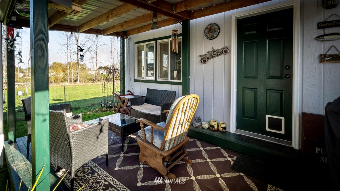 291 Spencer Road Sequim, WA 98382 - Photo 18 of 24 a view of a porch with seating space