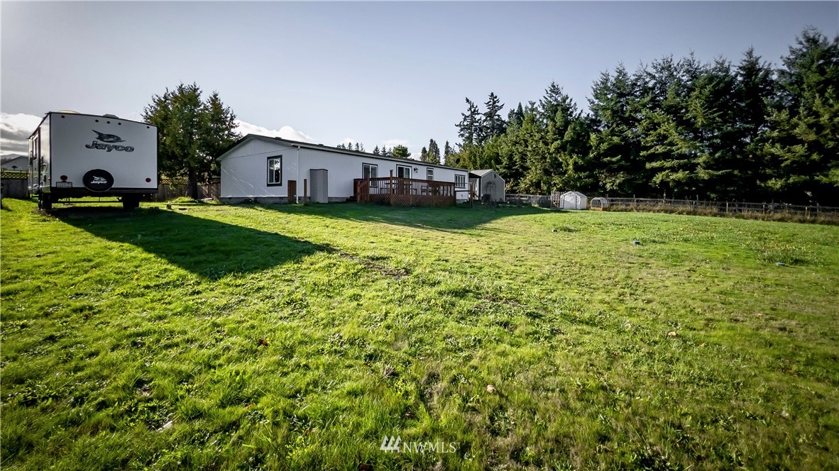 291 Spencer Road Sequim, WA 98382 - Photo 3 of 24 a aerial view of a house with a big yard