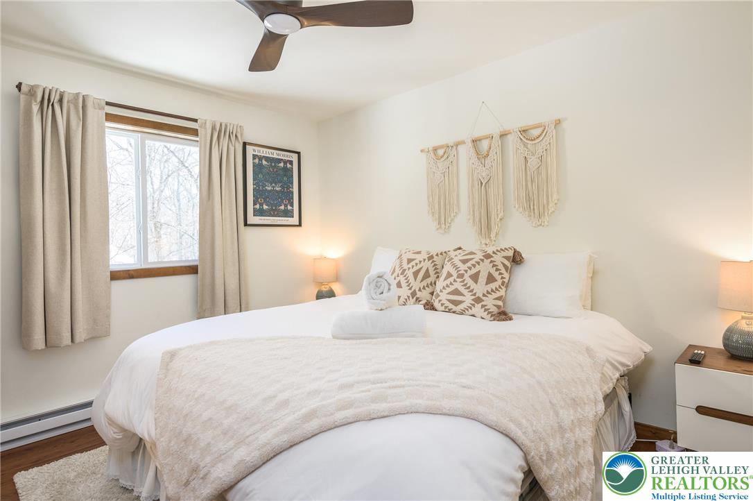 2206 Chatham Court Bushkill, PA 18324 - Photo 11 of 45 a bedroom with a bed and a window