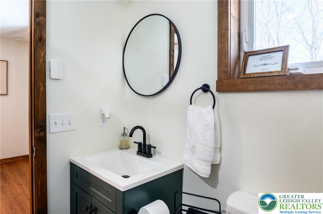 2206 Chatham Court Bushkill, PA 18324 - Photo 13 of 45 a bathroom with a sink and a mirror