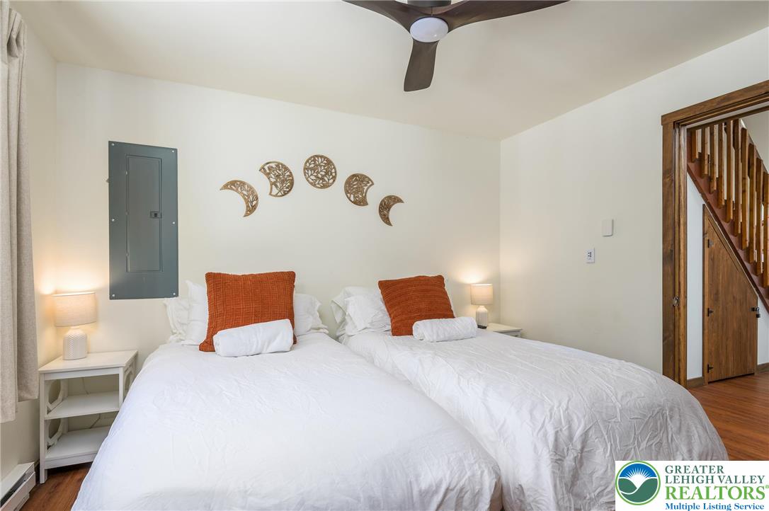 2206 Chatham Court Bushkill, PA 18324 - Photo 16 of 45 a bedroom with a bed and a painting on the wall