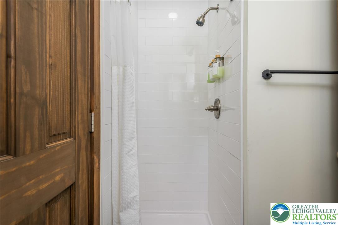 2206 Chatham Court Bushkill, PA 18324 - Photo 18 of 45 a bathroom with a shower