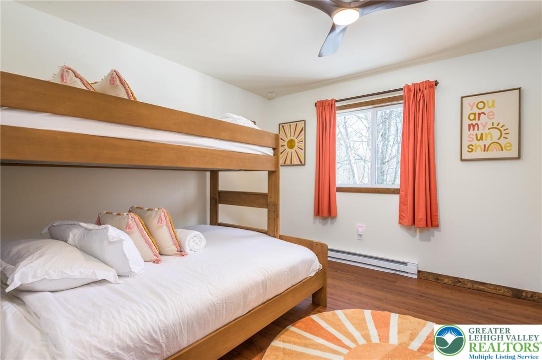 2206 Chatham Court Bushkill, PA 18324 - Photo 20 of 45 a bedroom with a bed and window