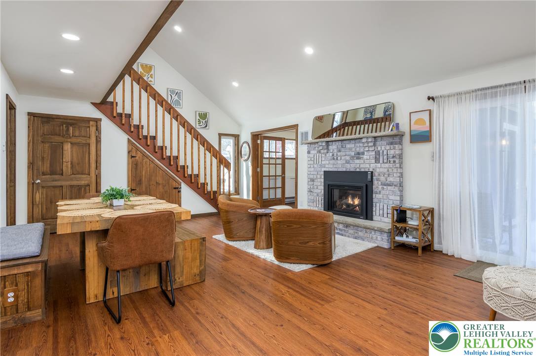 2206 Chatham Court Bushkill, PA 18324 - Photo 2 of 45 a living room with furniture and a fireplace