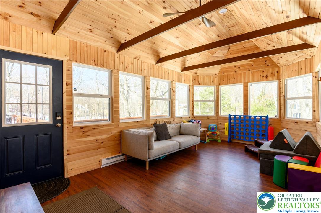 2206 Chatham Court Bushkill, PA 18324 - Photo 21 of 45 a living room with furniture and a large window