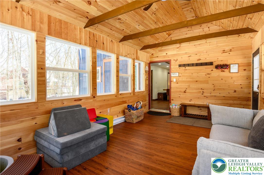 2206 Chatham Court Bushkill, PA 18324 - Photo 22 of 45 a living room with furniture and wooden floor