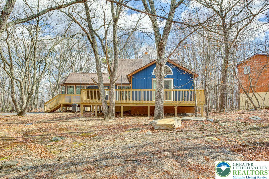 2206 Chatham Court Bushkill, PA 18324 - Photo 27 of 45 a front view of a house with a yard covered with snow