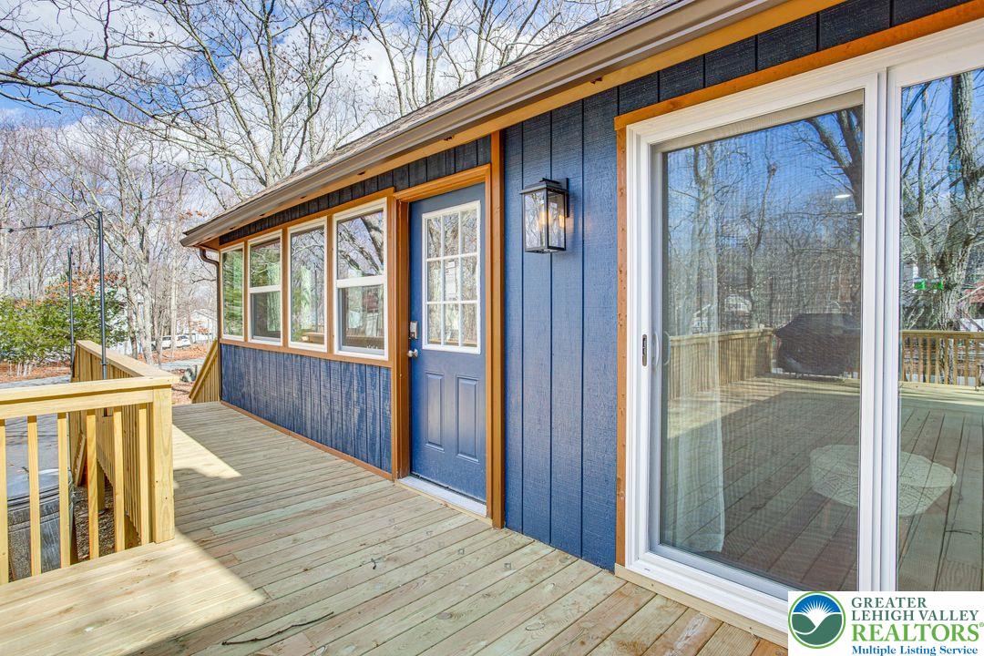 2206 Chatham Court Bushkill, PA 18324 - Photo 29 of 45 a view of a house with a wooden deck