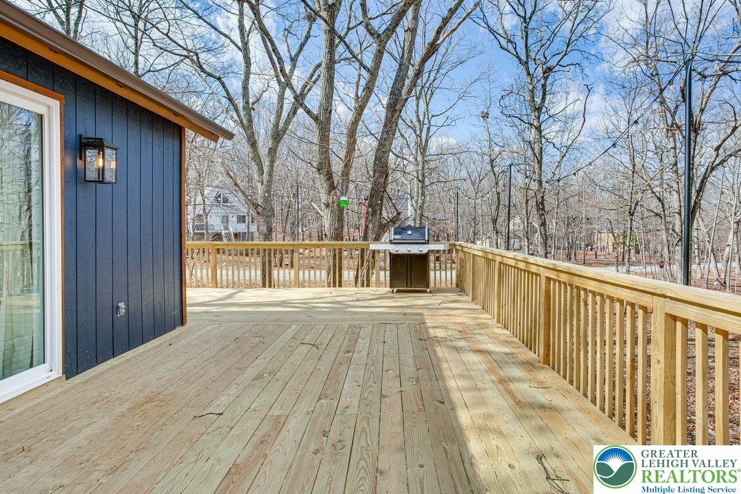 2206 Chatham Court Bushkill, PA 18324 - Photo 30 of 45 a view of backyard with wooden floor and fence