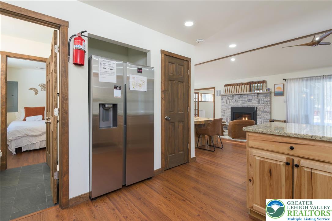 2206 Chatham Court Bushkill, PA 18324 - Photo 7 of 45 a hall way with furniture and wooden floor