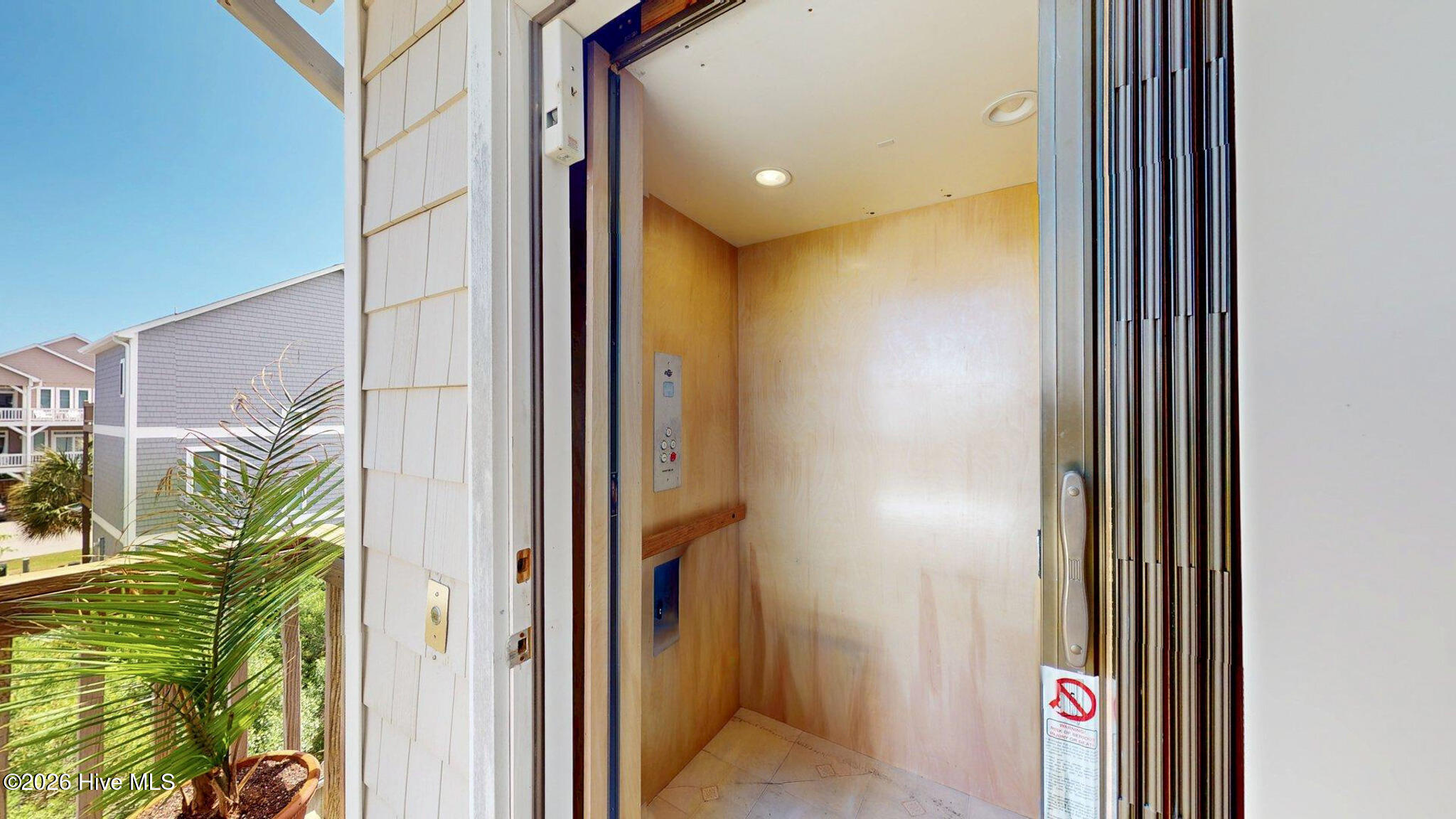 58 N Ridge Surf City, NC 28445 - Photo 4 of 50 Rear deck elevator goes to all floors via garage.