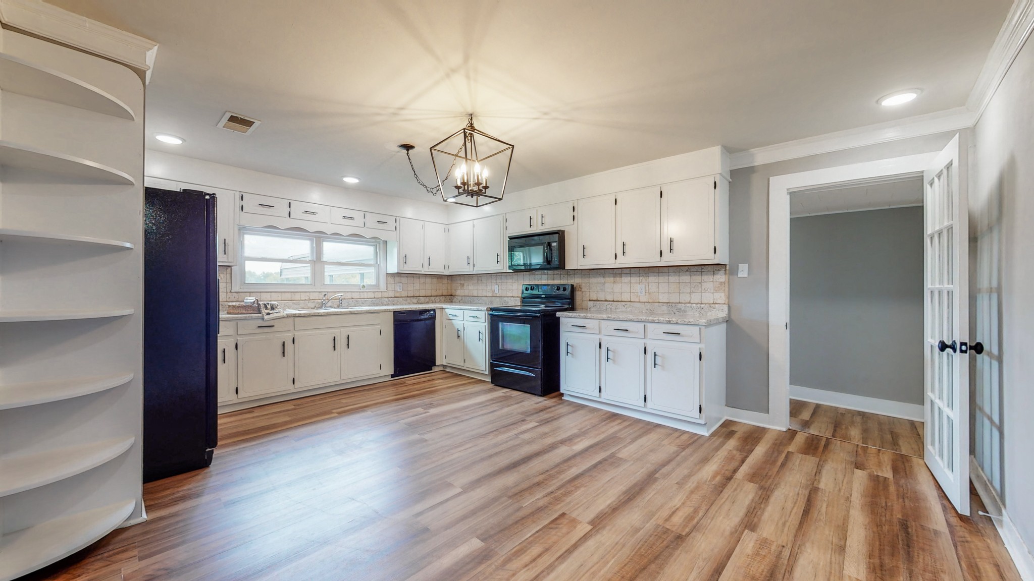 255 Limestone Road Elora, TN 37328 - Photo 3 of 45 a large kitchen with stainless steel appliances granite countertop a lot of counter space and wooden floors