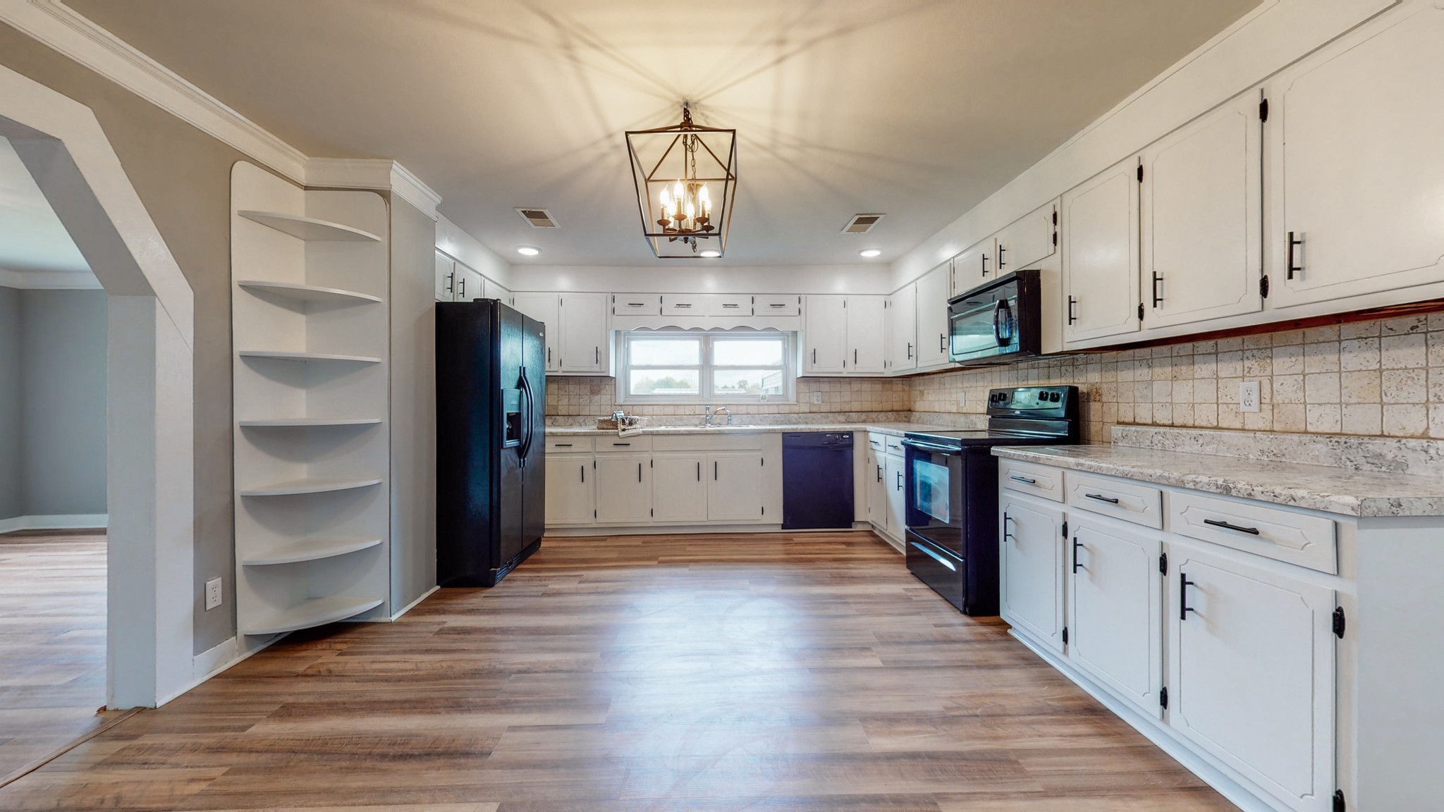 255 Limestone Road Elora, TN 37328 - Photo 4 of 45 a kitchen with stainless steel appliances granite countertop a refrigerator a sink dishwasher a stove and white cabinets with wooden floor