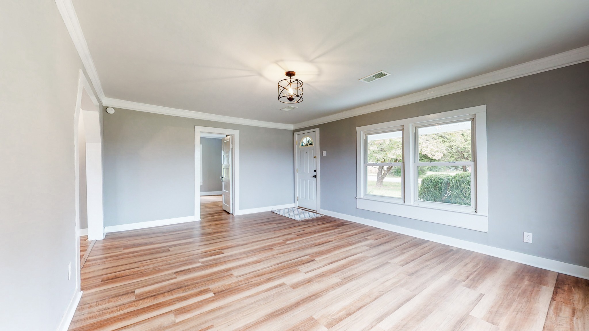 255 Limestone Road Elora, TN 37328 - Photo 8 of 45 a view of an empty room with wooden floor and a window