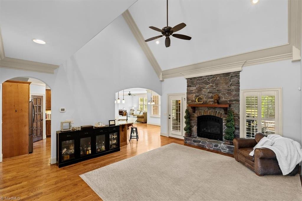 7787 Sutter Road Greensboro, NC 27455 - Photo 8 of 50 Vaulted Great room with stone fireplace