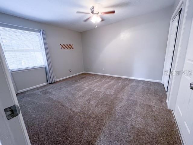 1928 Lawson Road Tallahassee, FL 32308 - Photo 14 of 20 an empty room with windows and fan