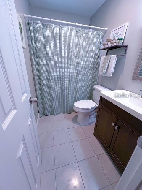 1928 Lawson Road Tallahassee, FL 32308 - Photo 15 of 20 a bathroom with a granite countertop sink and a toilet