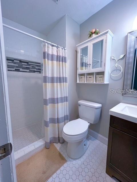 1928 Lawson Road Tallahassee, FL 32308 - Photo 16 of 20 a bathroom with a sink toilet and shower
