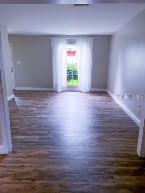 1928 Lawson Road Tallahassee, FL 32308 - Photo 3 of 20 wooden floor in an empty room with a window