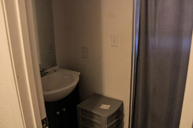 a bathroom with a sink and mirror